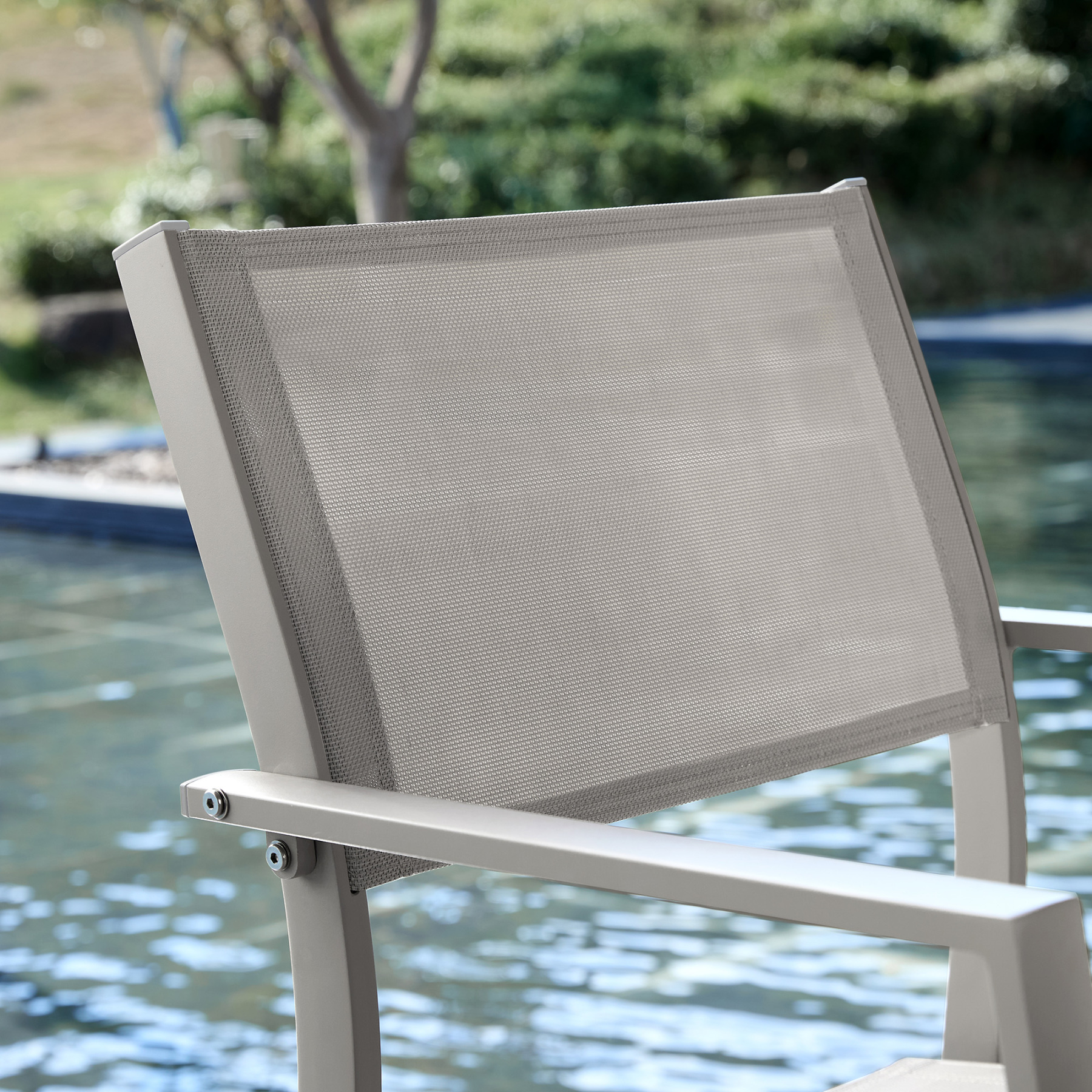 Outdoor lounge chair with mesh backrest near pool - Seehill