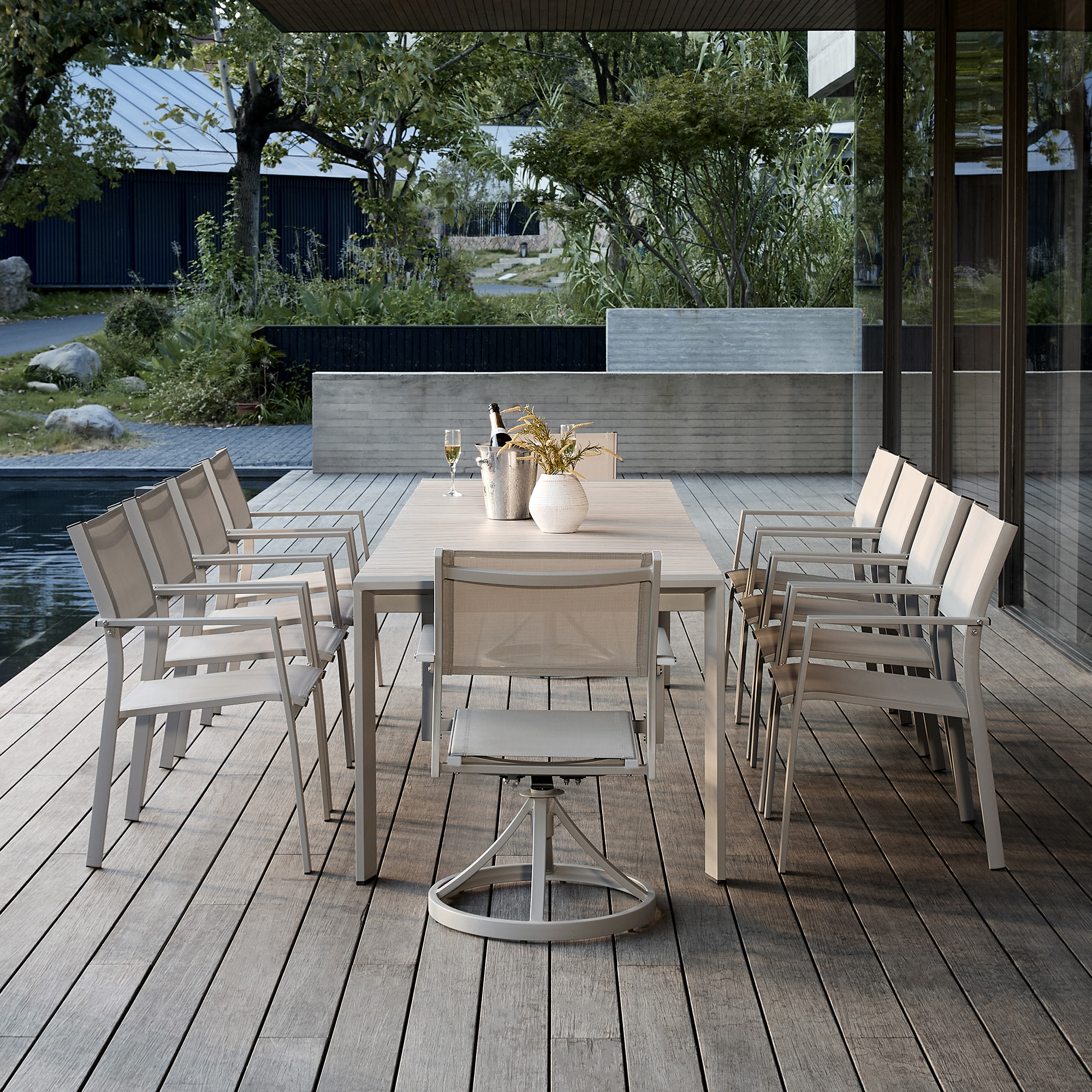 Highlighting the modern outdoor dining set with beige mesh chairs of this refined piece outdoor collection. - Seehill