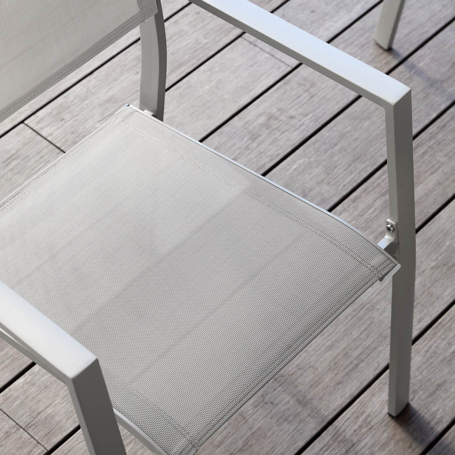 Modern outdoor chair with mesh seat and armrests, white frame - Seehill