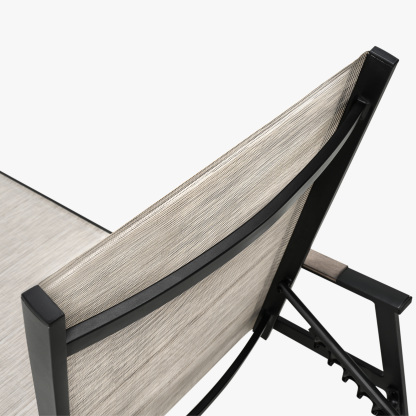 Modern outdoor lounge chair with black frame and beige fabric seat - Seehill