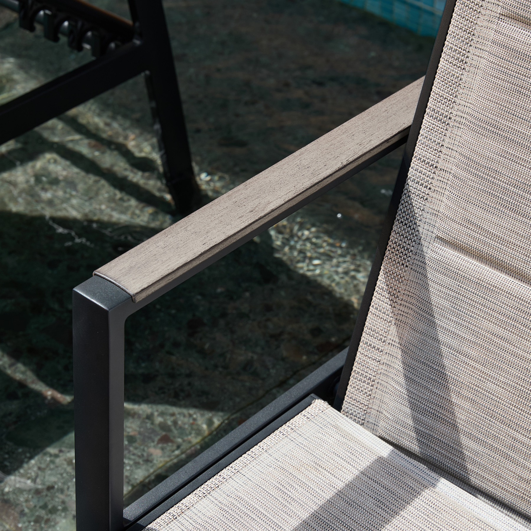 Outdoor lounge chair with wooden armrest and beige fabric seat - Seehill