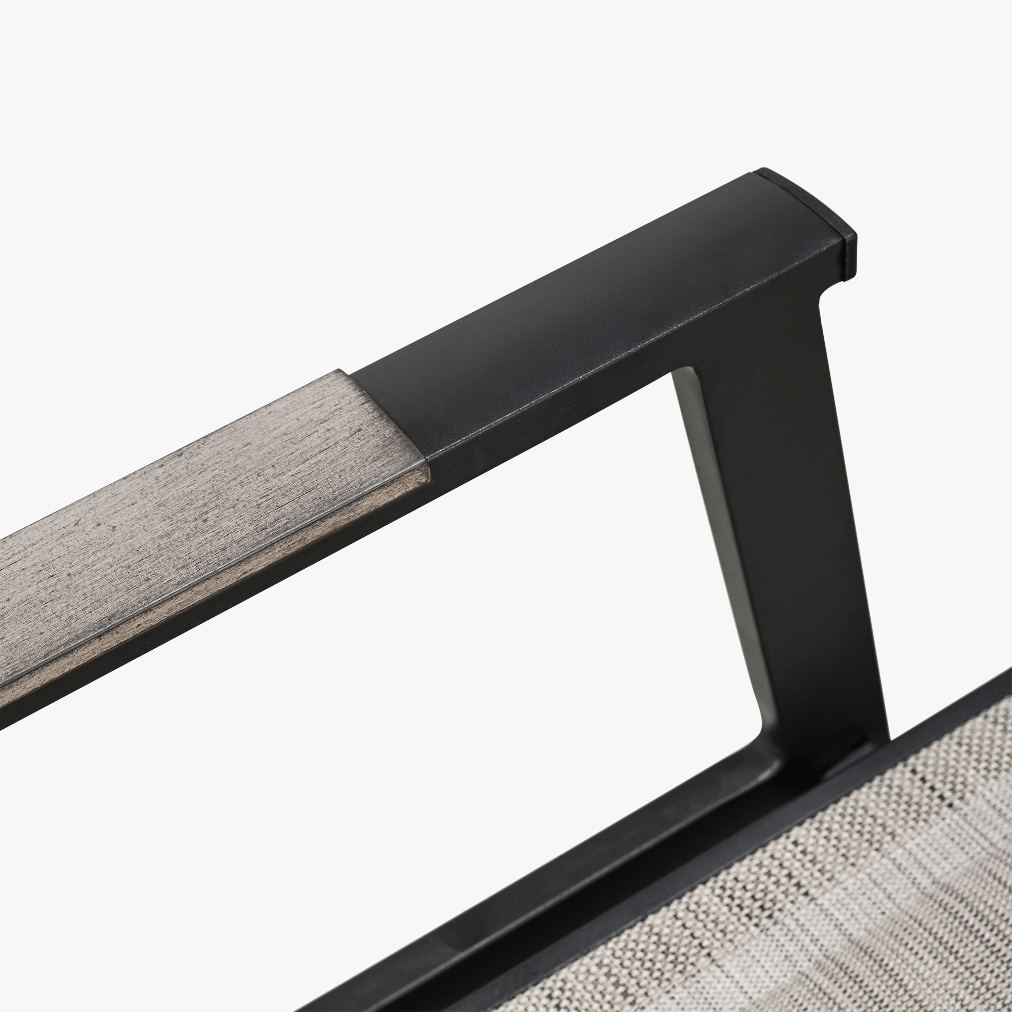 Highlighting the modern black metal and wood armrest detail of this refined Outdoor Chaise Lounge Chair. - Seehill