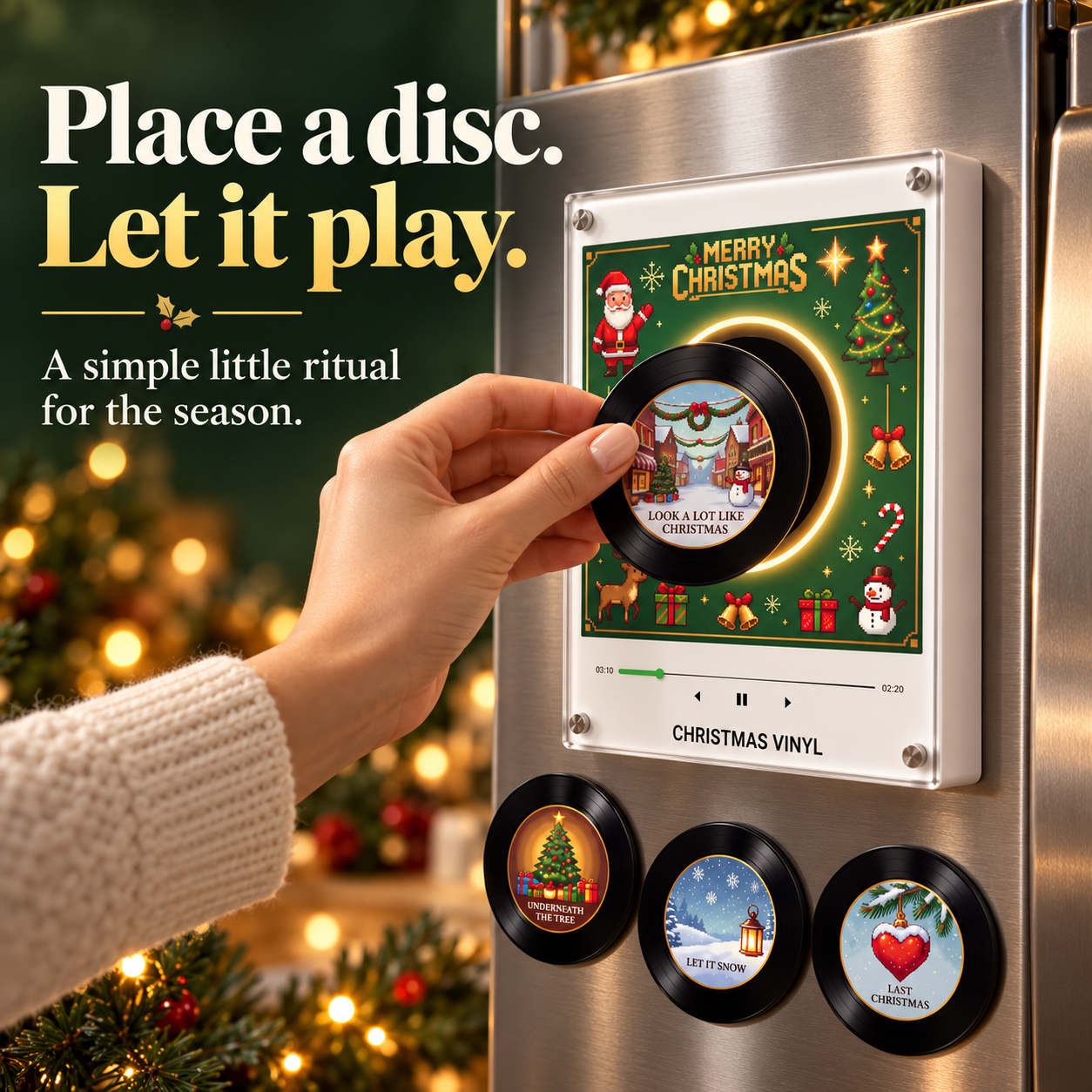 Hand placing a mini Christmas record on the illuminated music frame