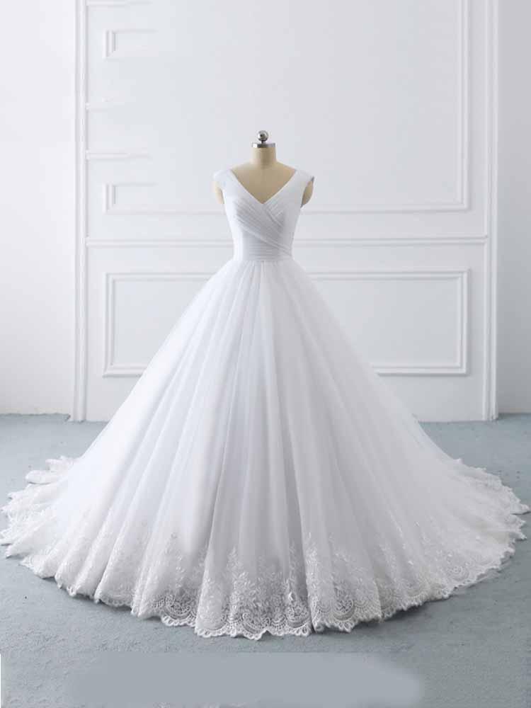 V-neck lace-up ball gown wedding dress with ruffles showing the waist and skirt join