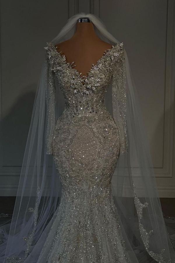 Cocosbride Close-up of sequined details and elegant sleeves on a luxury mermaid wedding dress