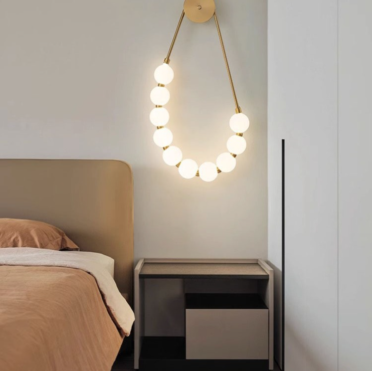 Valentina modern Nordic gold wall lamp in a bedroom