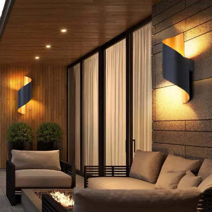 Orr conch shape metal wall light in outdoor setting.