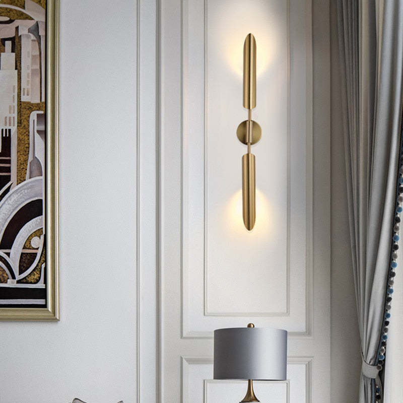 Meza Modern LED Wall Lamp in Gold, illuminating a room