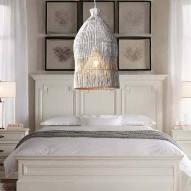 Muto Birdcage LED pendant light above a bed in a bedroom