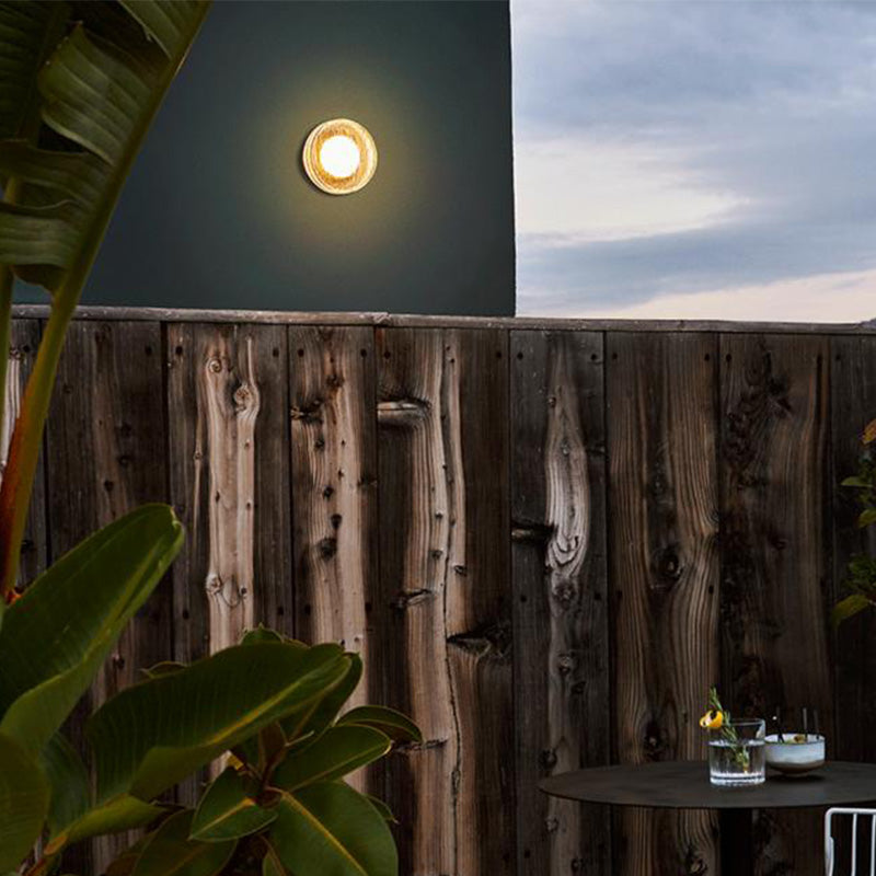 Outdoor wall lamp illuminating patio, Valentina design