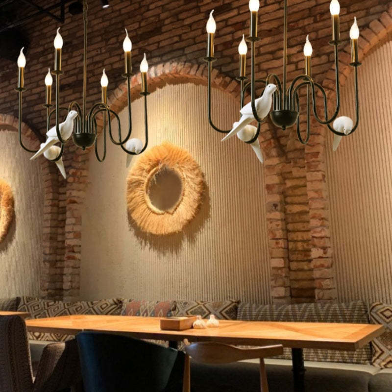 Vintage chandelier with bird accents in a cafe setting