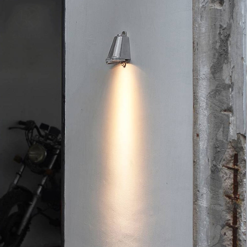 Orr metal bell wall lamp shines near motorbike