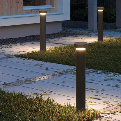 Modern outdoor path lights illuminating a garden