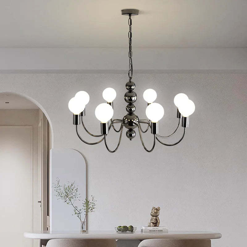 Valentina Medieval Chandelier illuminating a modern dining room