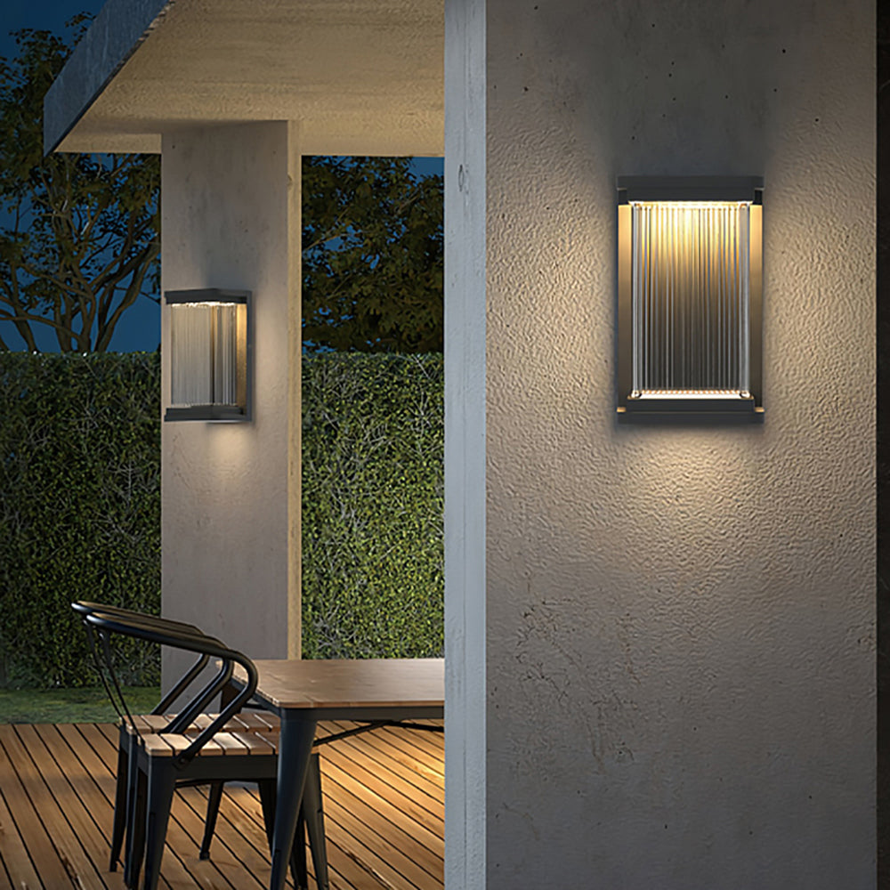 Outdoor wall lamp illuminates patio at night