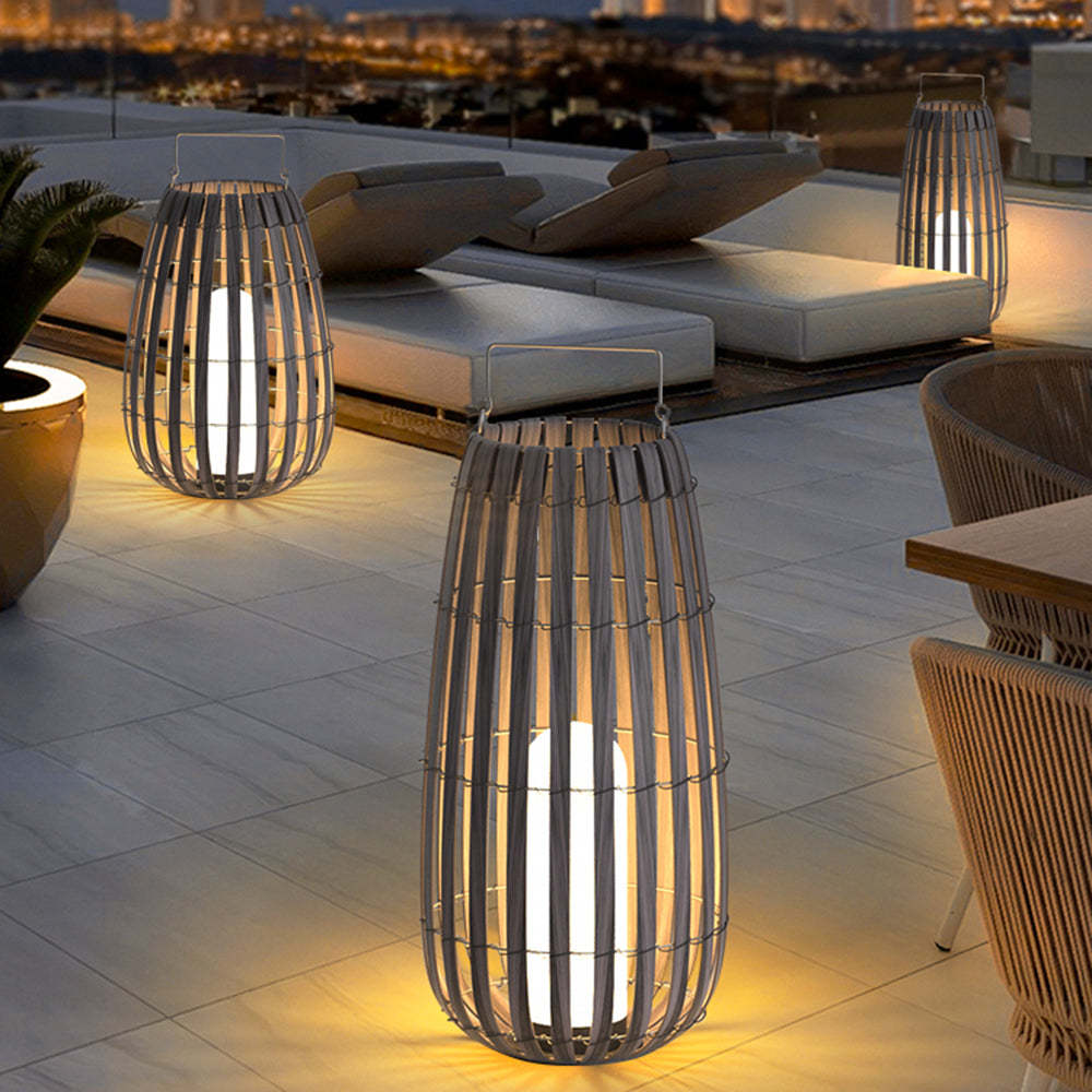 Muto Retro Lantern floor lamps illuminating outdoor patio at night