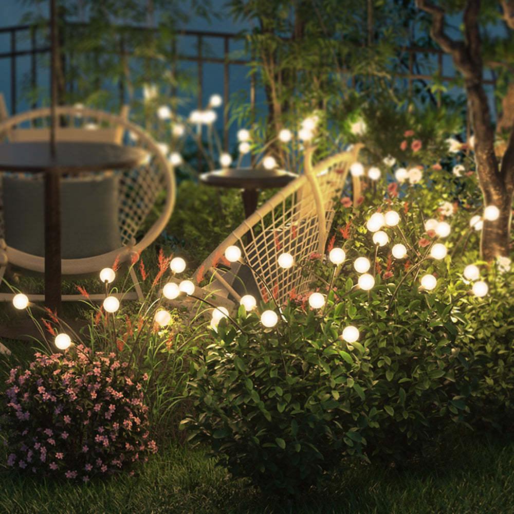 Orr outdoor post lights illuminating garden at night