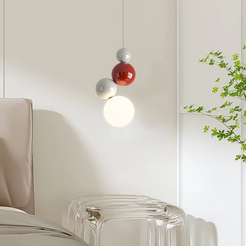Modern Valentina pendant light with red and white orb design, bedroom lighting