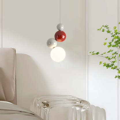 Modern Valentina pendant light with red and white orb design, bedroom lighting