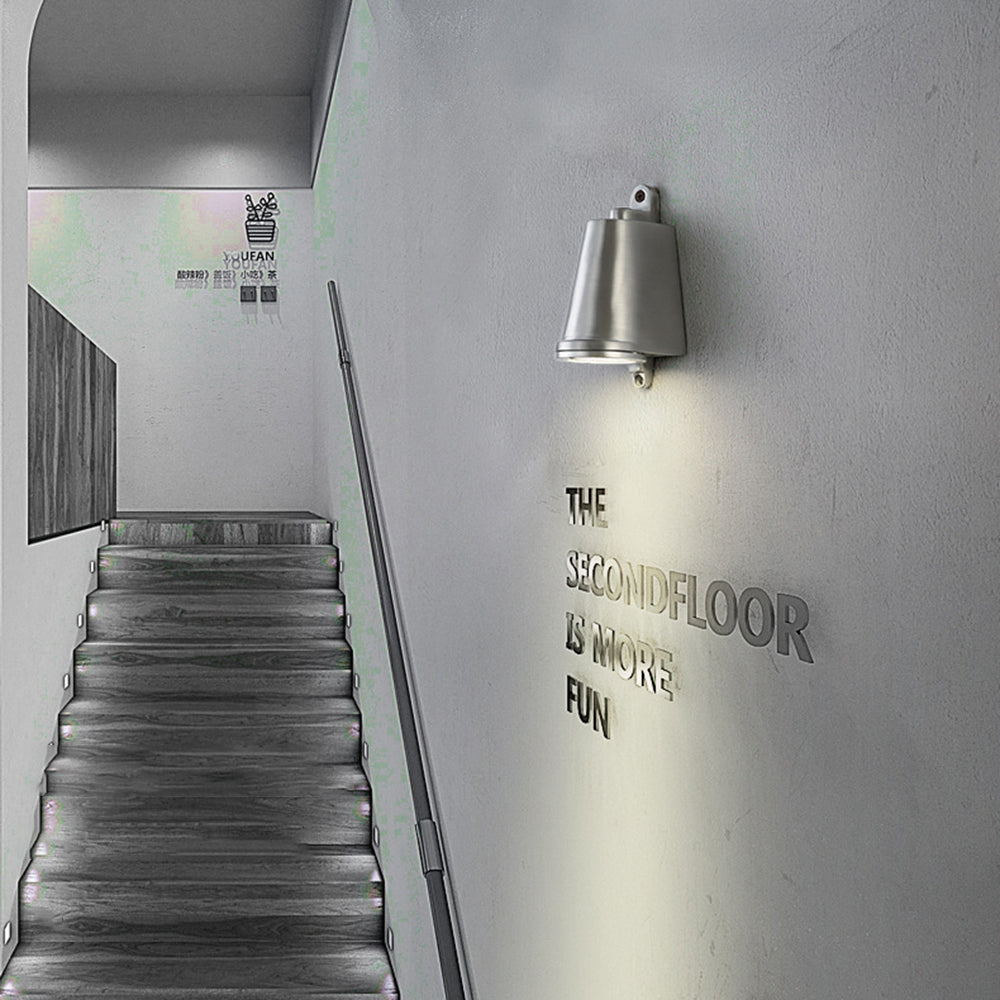 Orr industrial metal wall lamp illuminates staircase to the second floor