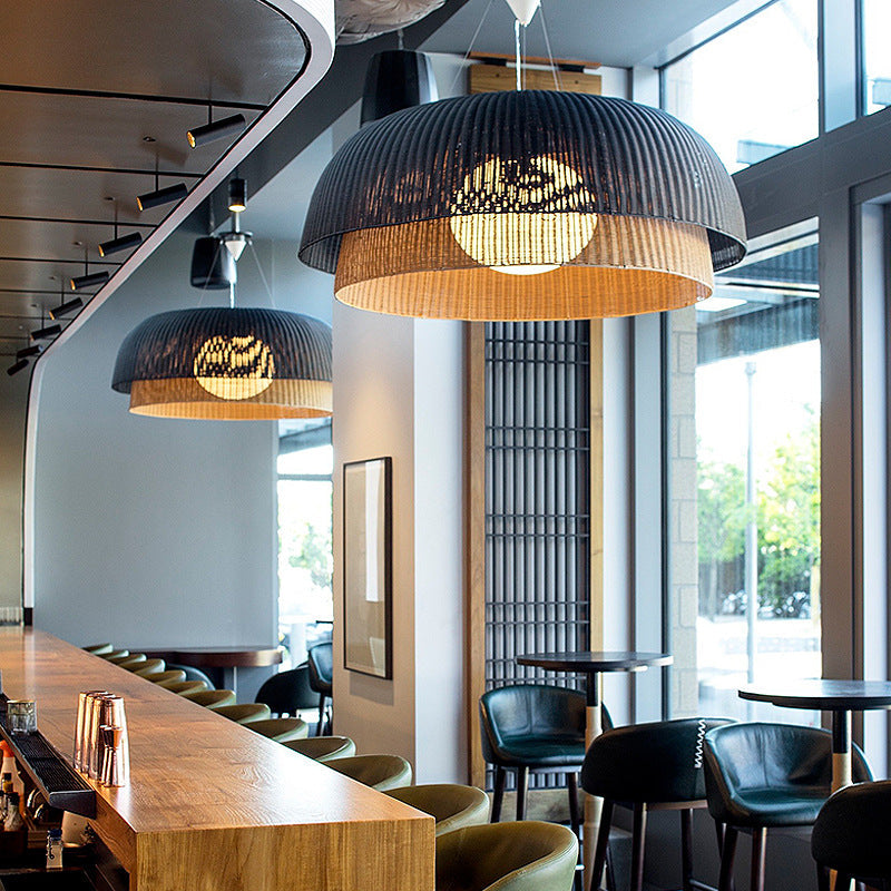 Ritta Cottage pendant light, metal and rattan, in a restaurant setting