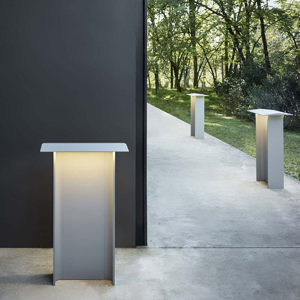 Orr outdoor path light illuminating a garden path