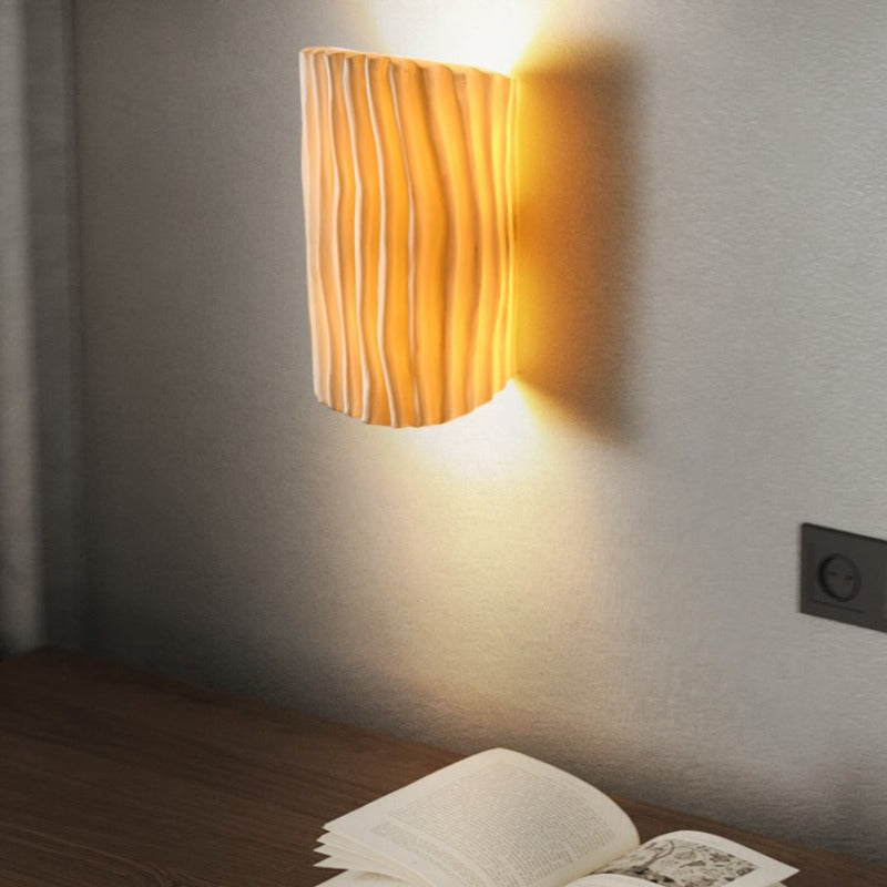 Morandi Wall Lamp illuminating bedroom setting