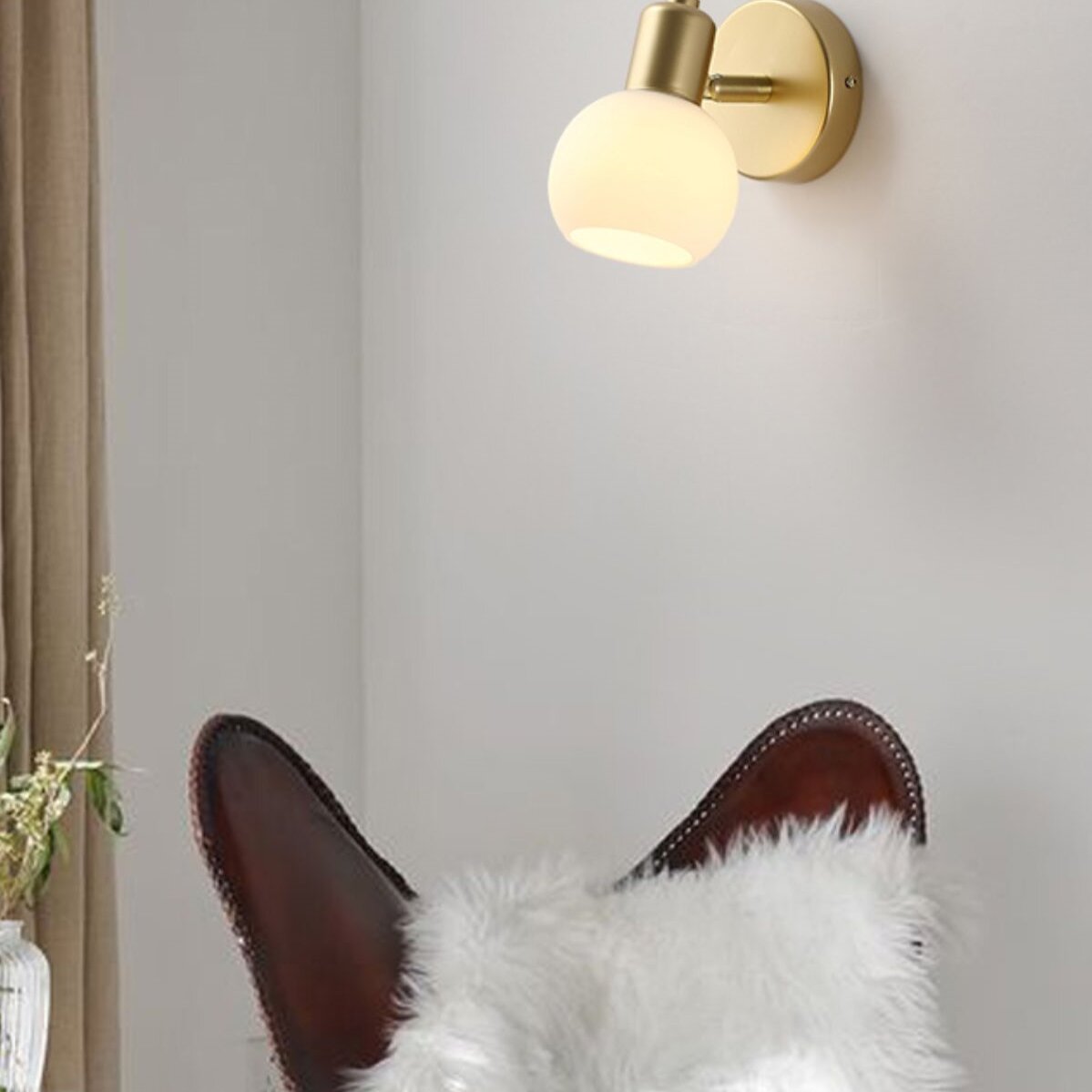 Valentina Modern Gold Wall Lamp in a bedroom setting