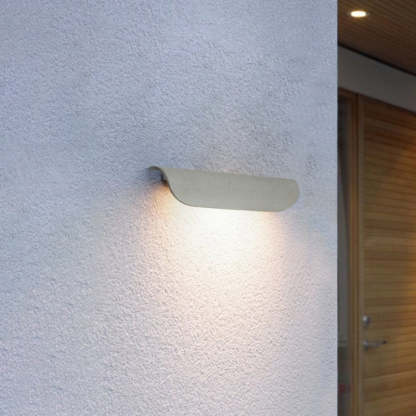 Orr Modern Curved Outdoor Wall Lamp illuminating wall