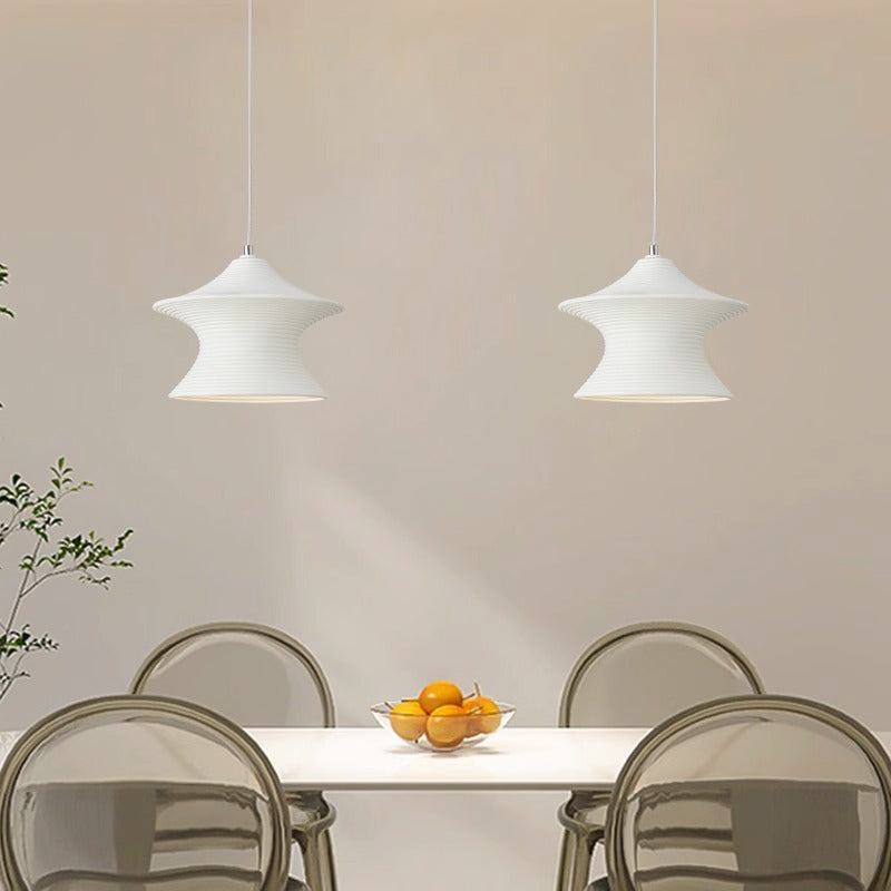 Modern minimalist pendant lights over dining table