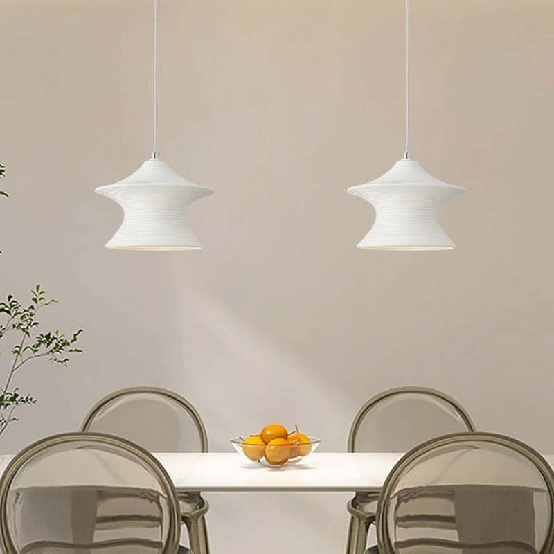 Modern minimalist pendant lights over dining table