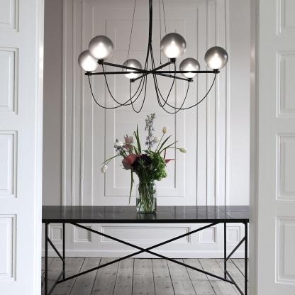 Valentina Chandelier over table with flowers, modern interior design