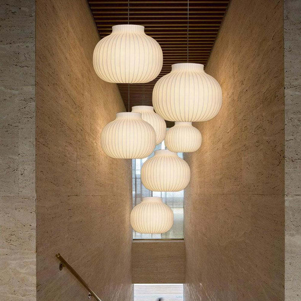 Renée pendant lights in a hallway