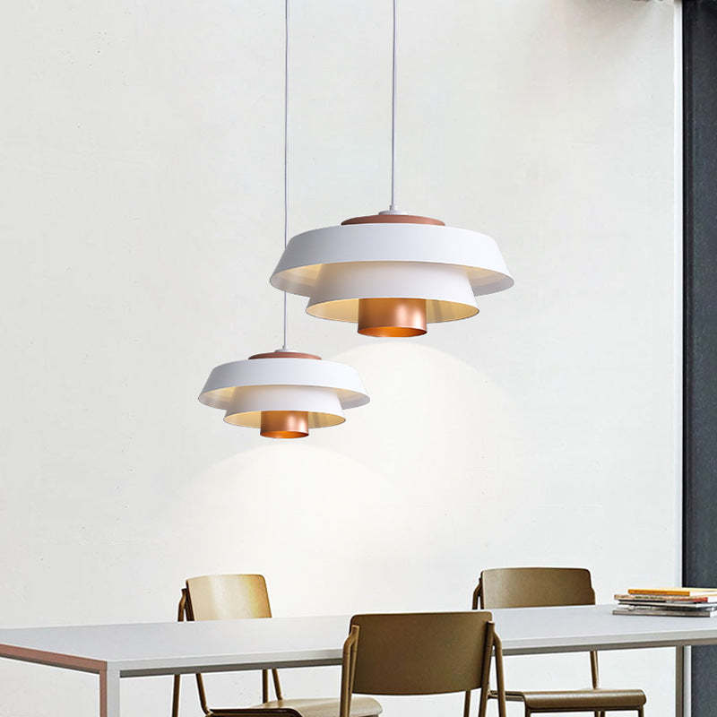 White and Copper Hailie Nordic Pendant Lights above dining table