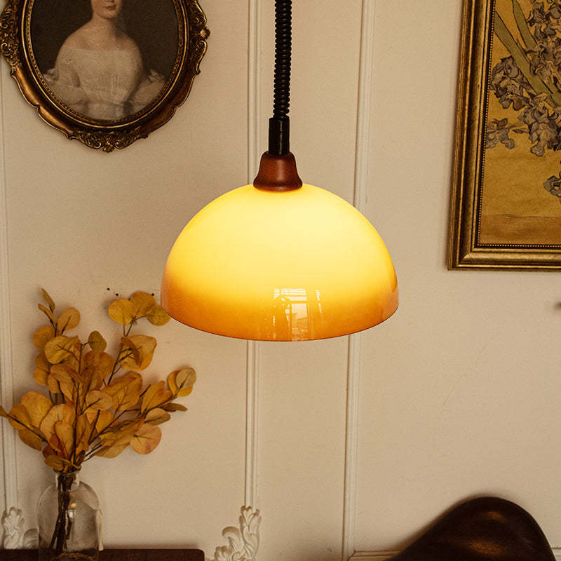 Hailie Retro Pendant Light with amber glass shade in a room setting