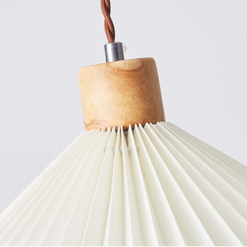 Ozawa pendant light: origami shade and wood base detail.