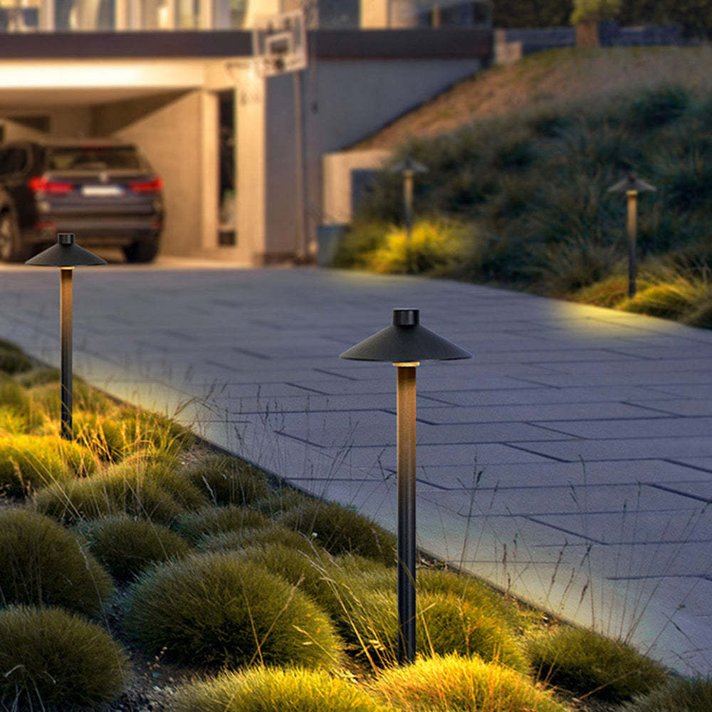 Contemporary Carins path lights illuminating a garden walkway