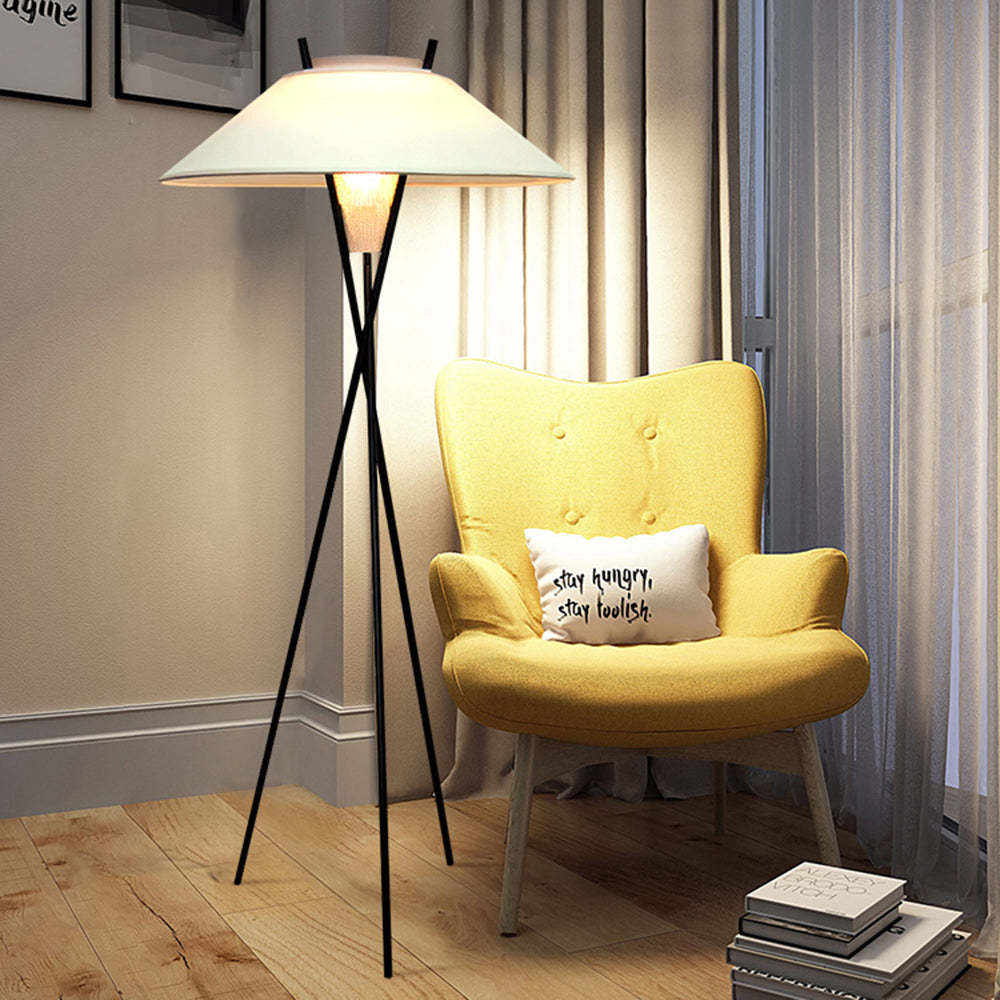 Carins Modern Floor Lamp next to yellow armchair with pillow