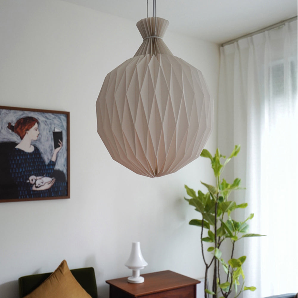 Minimalist paper globe pendant light Renée in a living room