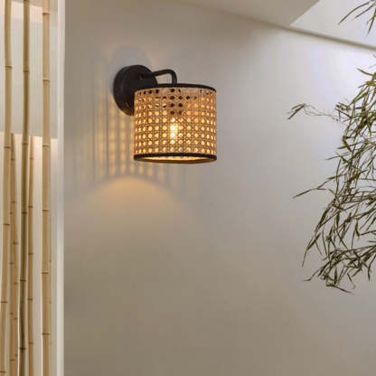 Rattan wall lamp illuminating a living space