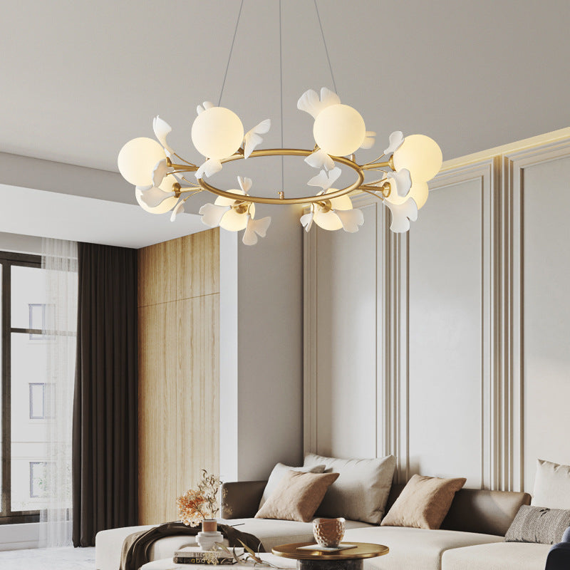 Olivia chandelier in modern living room, leaf design, gold finish