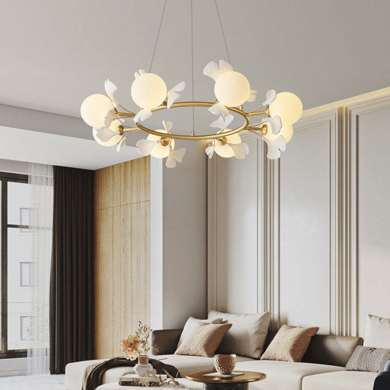 Olivia chandelier in modern living room, leaf design, gold finish