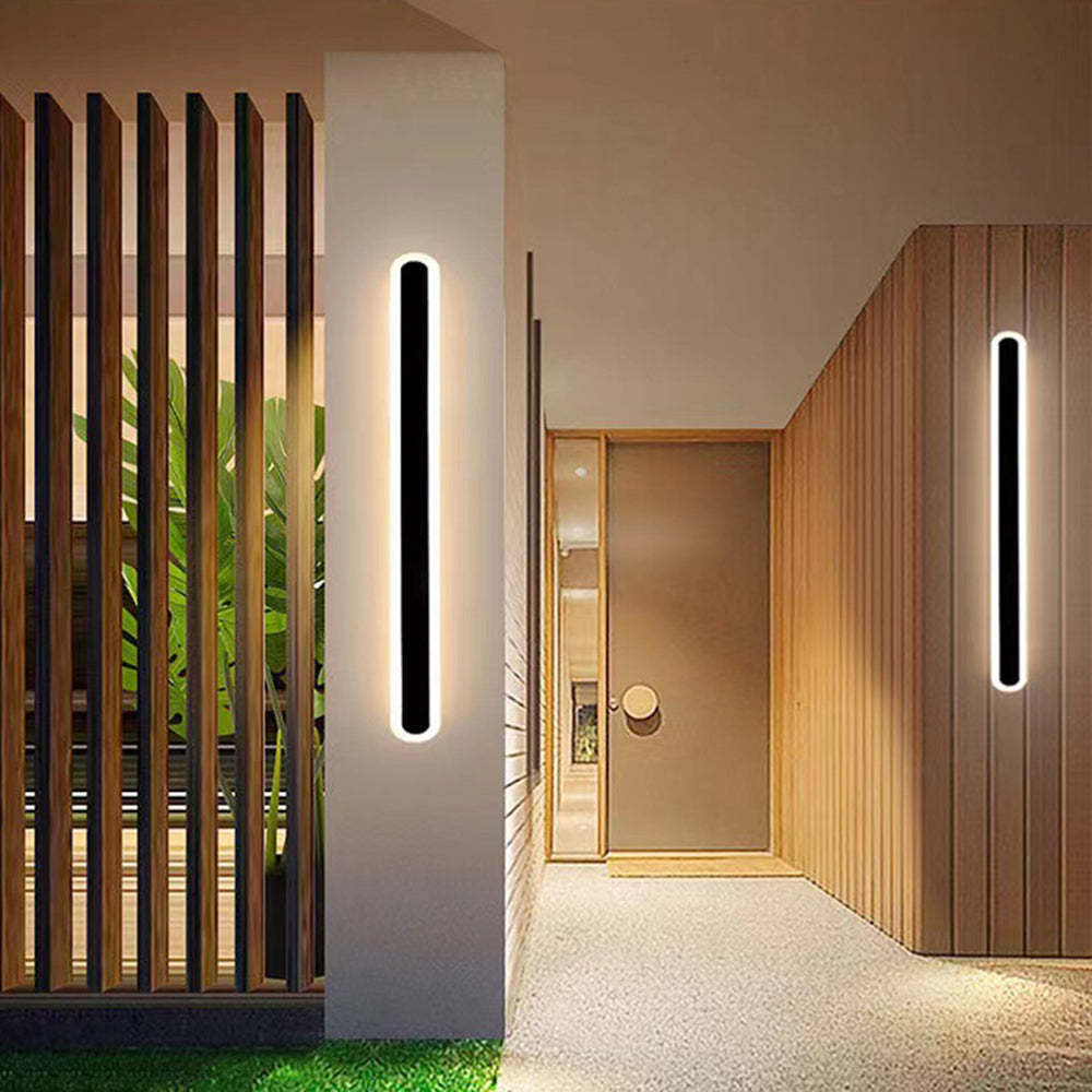 Modern black oval outdoor wall lighting fixture.