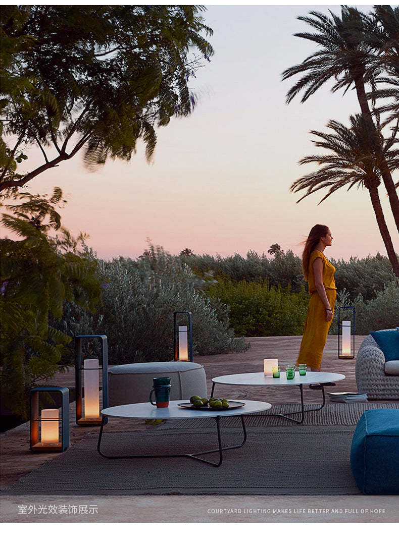 Orr minimalist outdoor floor lamps illuminate patio at dusk. Las Sola Orr Minimalist Cuboid Candle Outdoor Floor Lamp Garden
