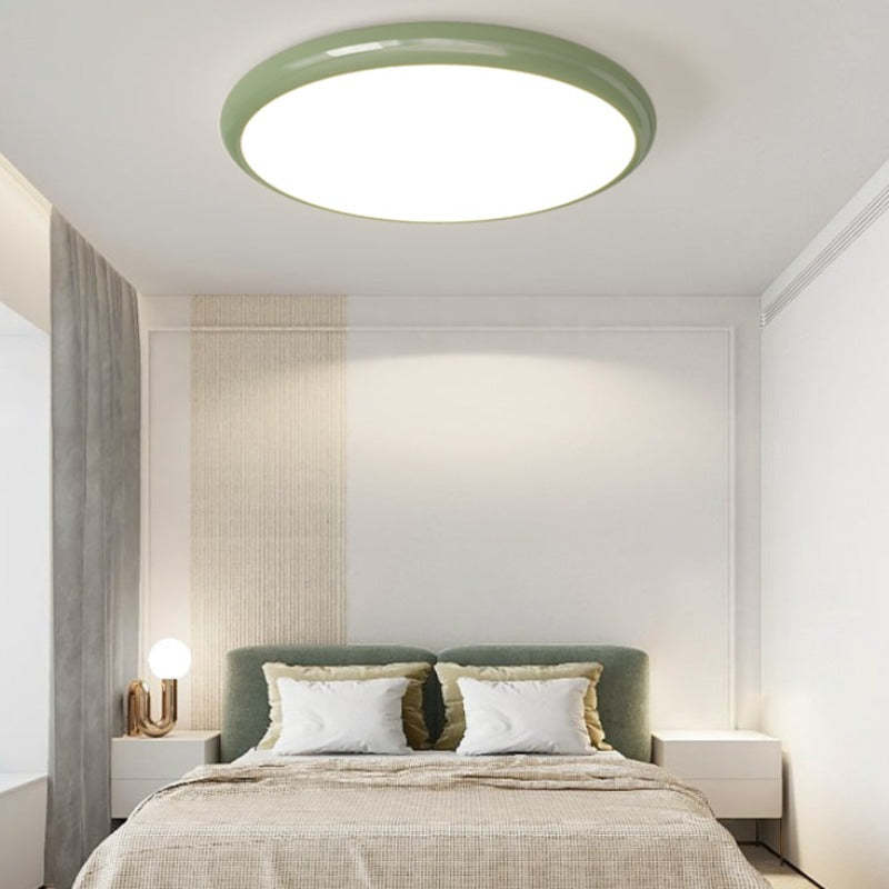 Ozawa green circle ceiling light over bed in bedroom