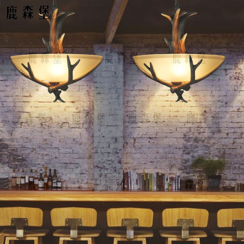 Silva Retro LED Pendant Light in dining room with wood and glass