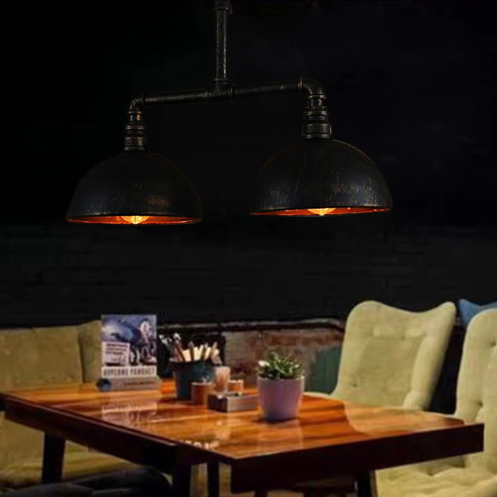 Alessio metal pendant lights over dining table. Industrial lighting.