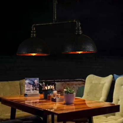 Alessio metal pendant lights over dining table. Industrial lighting.