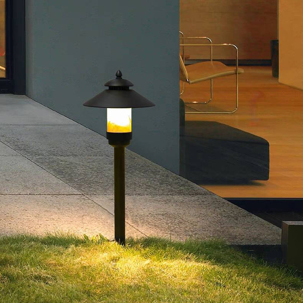 Carins outdoor path light illuminating a garden