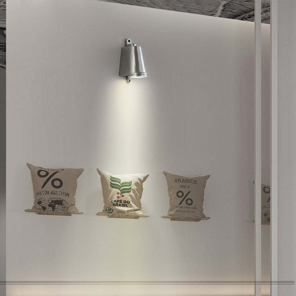 Orr metal wall lamp above coffee bean bag art.